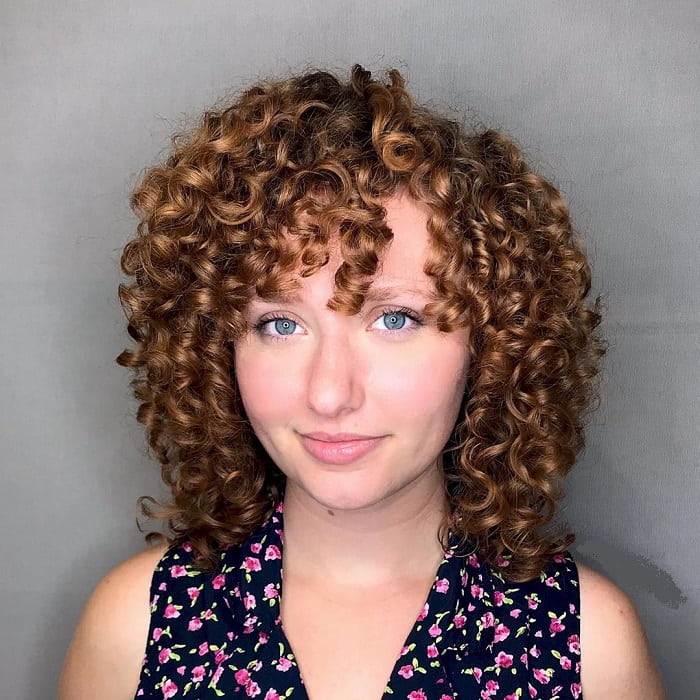 curly bob with bangs