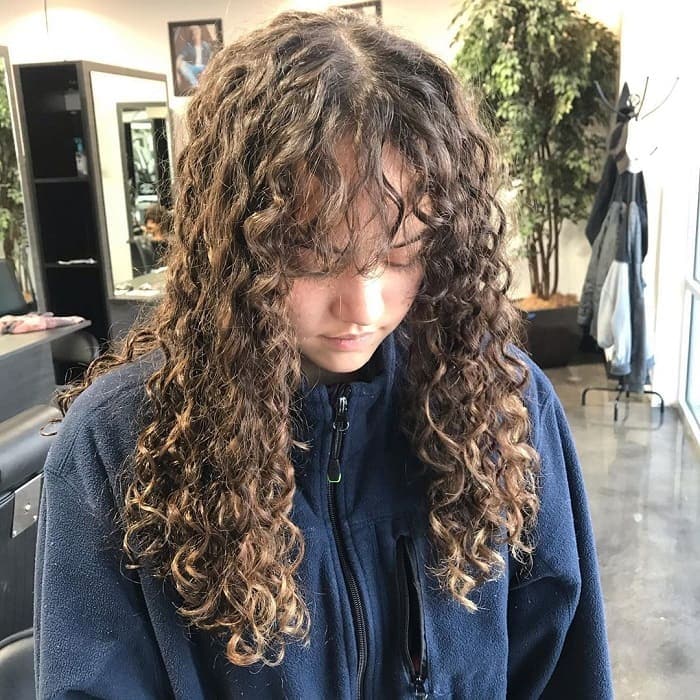 Curly Brown Hair with Long Bangs